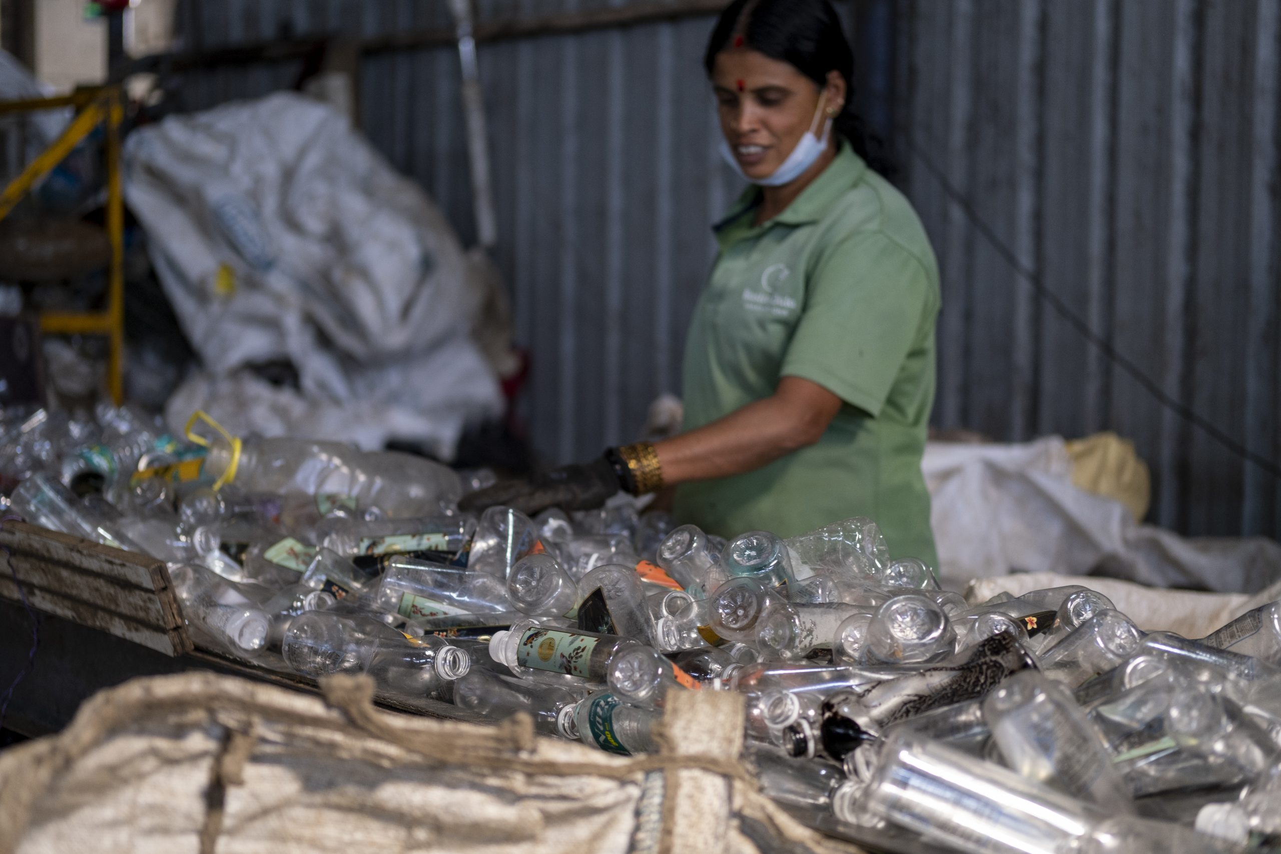 One of the PET sorters segregates different kinds of plastic waste before these are converted into recyclable plastic bales at Hasiru Dala Aggregation Centre, Kambipura, Bangalore.